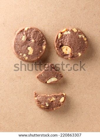 chocolate cookies look like face on wood background