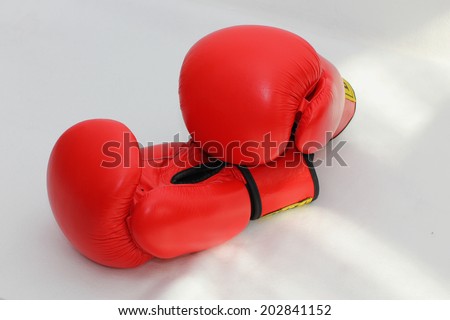 A pair of red boxing gloves. Sports equipment for martial arts