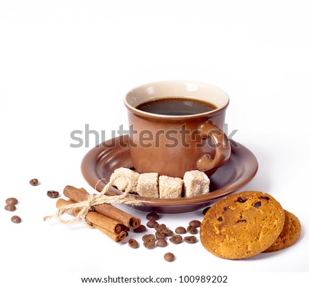 coffee cup and beans, cinnamon sticks, cookies, sugar