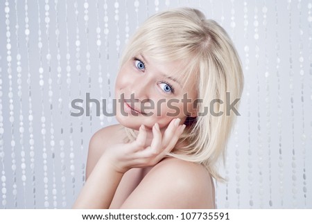 Beautiful young lady with blond hair and blue eyes, portrait