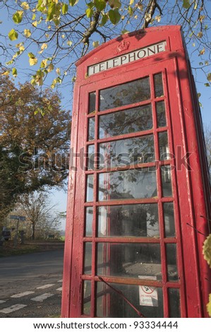English red telephone booth , Milden crossroads in Suffolk, UK