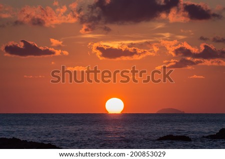 Sun and sea at sunset. Tyrrhenian Sea, region of Calabria, Italy.