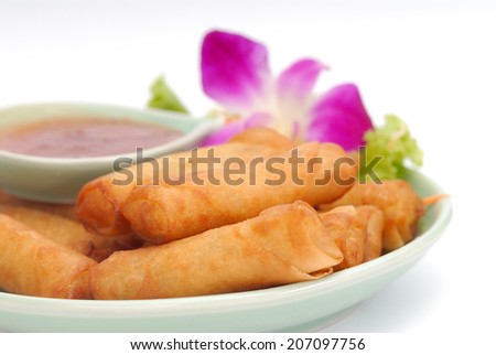 Delicious thai spring rolls with spicy pepper sauce.