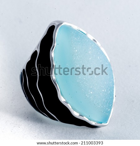 An Image of Accessories,ring of the jeweler with blue sapphire and brilliants on a white background