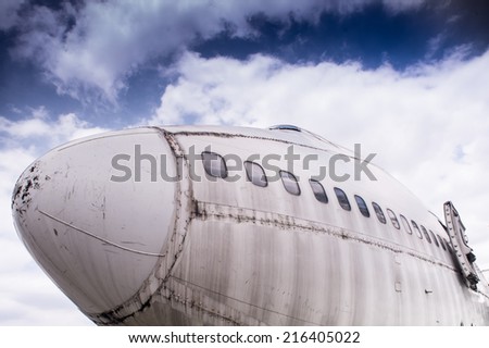 Abandoned Airplane,old crashed plane with cloudy sky,plane wreck tourist attraction