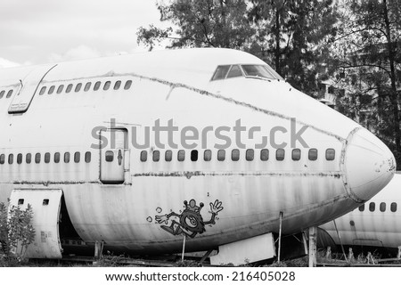 Abandoned Airplane,old crashed plane with cloudy sky,plane wreck tourist attraction