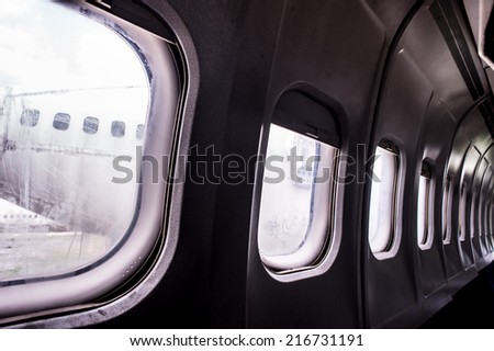 Windows detail of a deteriorated airplane,Old airplane,Airplane wreck on a jungle, forest. Crashed eliminators.