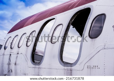 Windows detail of a deteriorated airplane,Old airplane,Airplane wreck on a jungle, forest. Crashed eliminators.