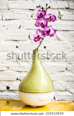 Vase of flowers on the table,Rose placed on the desk in white background