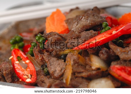 chinese black bean beef stir fry,Pan of the chicken, pepper, mushroom, onion and tomato,Sizzling beef with black pepper