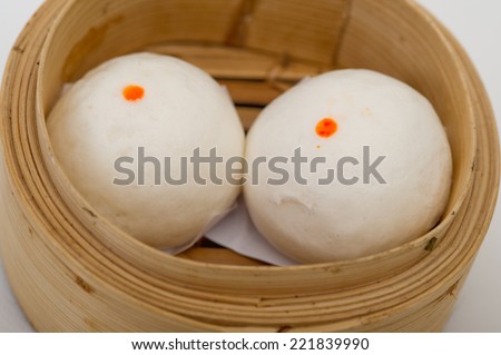 steamed Chinese bun in bamboo basket isolated on white background,yumcha, dim sum in bamboo steamer, chinese cuisine