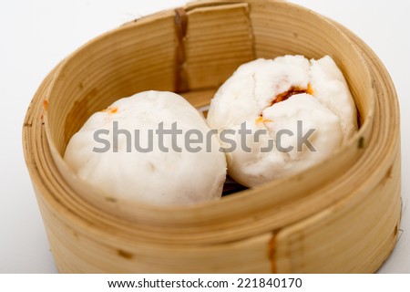 steamed Chinese bun in bamboo basket isolated on white background,yumcha, dim sum in bamboo steamer, chinese cuisine