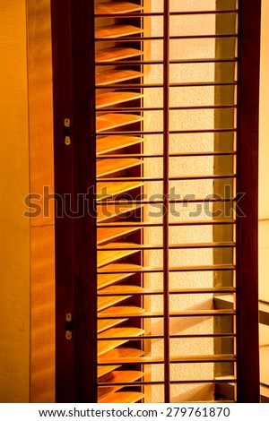 The light from the windows,blinds,Sunlight behind vertical blinds