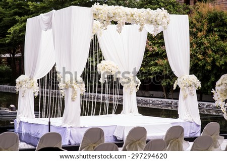 romantic white wedding table set up on tropical beach,wedding set up