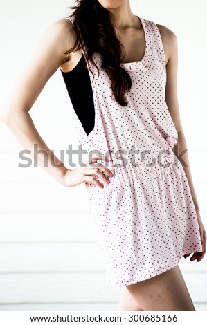 Young woman wearing blank sleeveless t-shirt,Young woman wearing blank vest. wall background.Casual Wear
