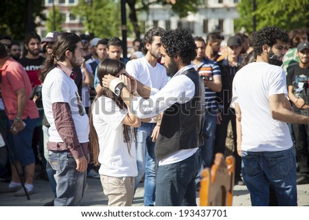ISTANBUL/TURKEY - MAY 18 2014: Syrian Demonstrators preparing to perform short sketch that illustrates Bashar Al-Assad's attachment to the presidency, and how far he will go to keep it.