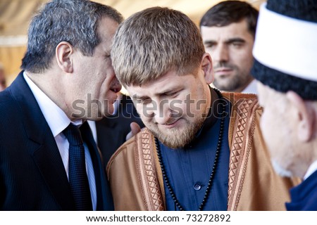 AMMAN, JORDAN - MAR 15: Vice president Ziad Sabsab translates to Chechen president Ramzan Kadyrov after accepting gift during visit to Jordan.  March 15, 2011 in Amman, Jordan.
