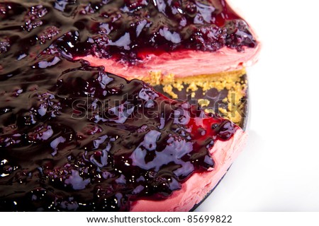 Strawberry flavored cheese cake with blackberry topping