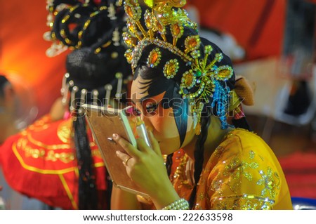 The chinese drama performer make-up before going on stage.(Vegetable festival 2014, China town, Bangkok, October 10, 2014)