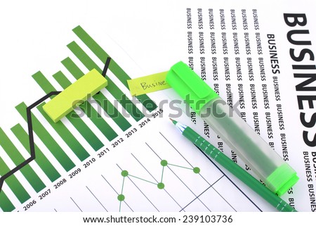Different types of charts, documents business with a green pen and green highlighter pen