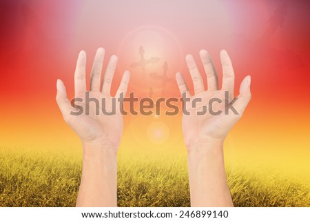 hand reaching for the cross on filters nature background