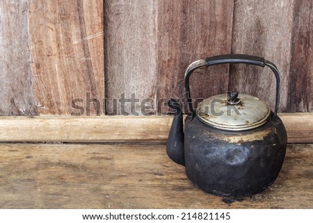 Old black kettle, Old black kettle on wood background.
