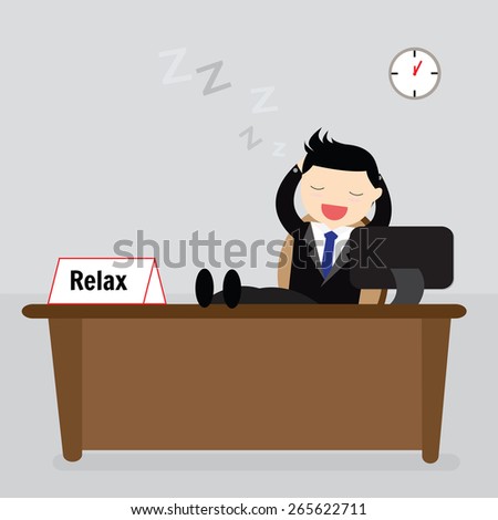 Businessman sitting relaxed with his feet on the desk and hands behind the head