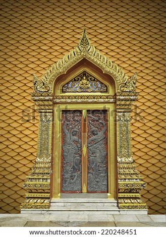 door thai art and wood carving door on orange texture