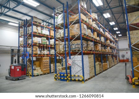 Blur Warehouse inventory product stock for logistic background, Long shelves with a variety of boxes