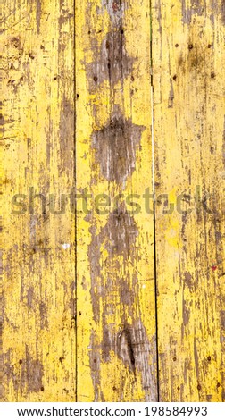 Old yellow painted wood wall damage surface