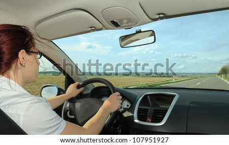 Woman driving with opened window