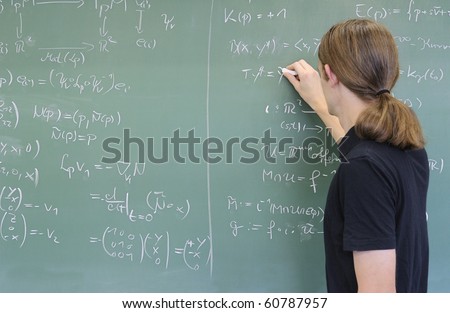 teacher / student writing math formulas on the chalkboard