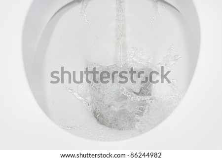 detail of flushing running water toilet flush