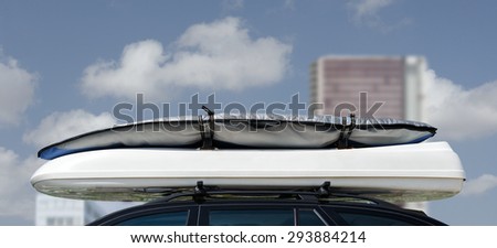 Luggage on car roof rack for vacations