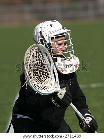 Girls high school lacrosse goalie. Editorial use only.
