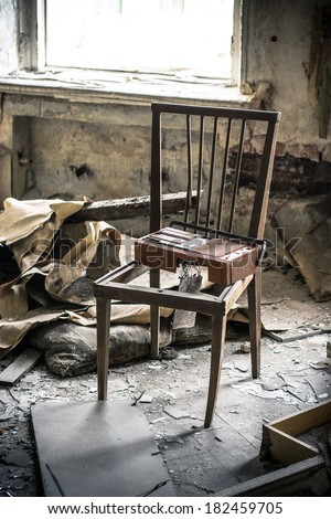 Old chair in abandoned room