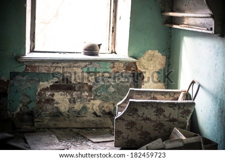 Old armchair in abandoned room