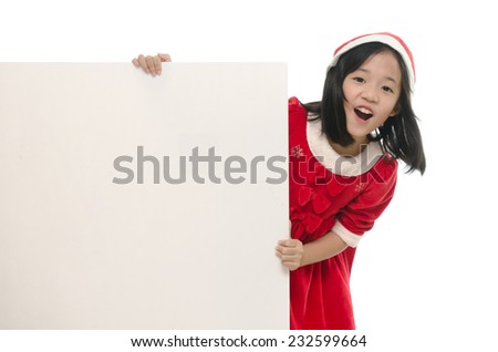 Beautiful asian girl in santa hat and red comforter behind white board onwhite back ground isolated