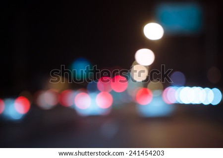 Blurred Defocused Lights of Traffic on a City Road at Night