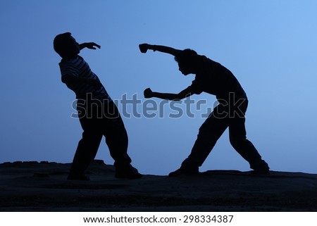 people fight (silhouette)