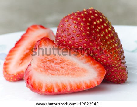 Cut-up strawberries on a plate