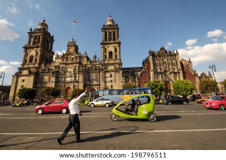 MEXICO CITY, MEXICO - OCTOBER 7, 2012: A busy street in the heart of the historic center of Mexico City in Mexico, with Catedral Metropolitana in the background.