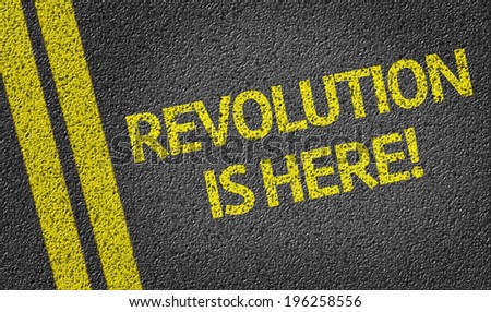 Revolution is Here written on the road