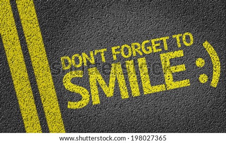 Don\'t Forget to Smile written on the road