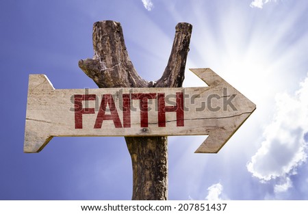 Faith wooden sign on a beautiful day