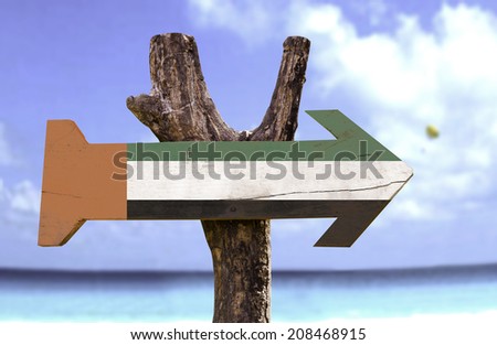 United Arab Emirates wooden sign with a river on background