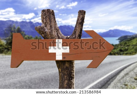 Switzerland wooden sign with a street background