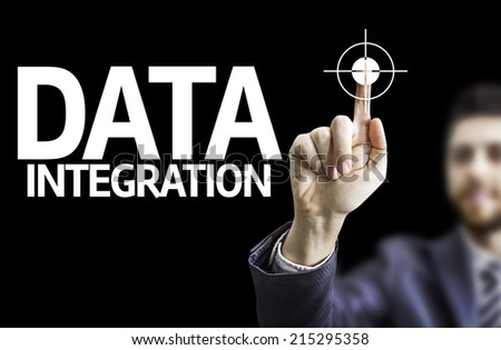 Business man pointing to black board with text: Data Integration