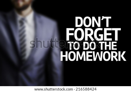Don\'t Forget to Do the Homework written on a board with a business man on background