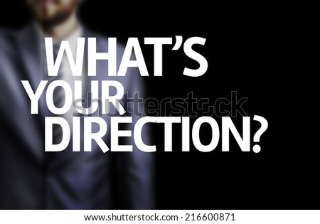 What\'s your Direction? written on a board with a business man on background